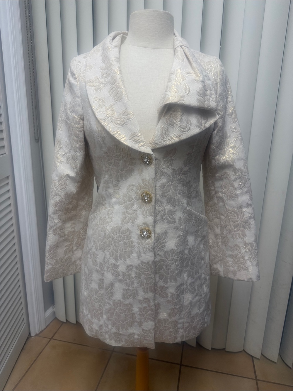 Harold’s Elegant Cream and Gold Floral Jacquard Coat with Rhinestone Buttons